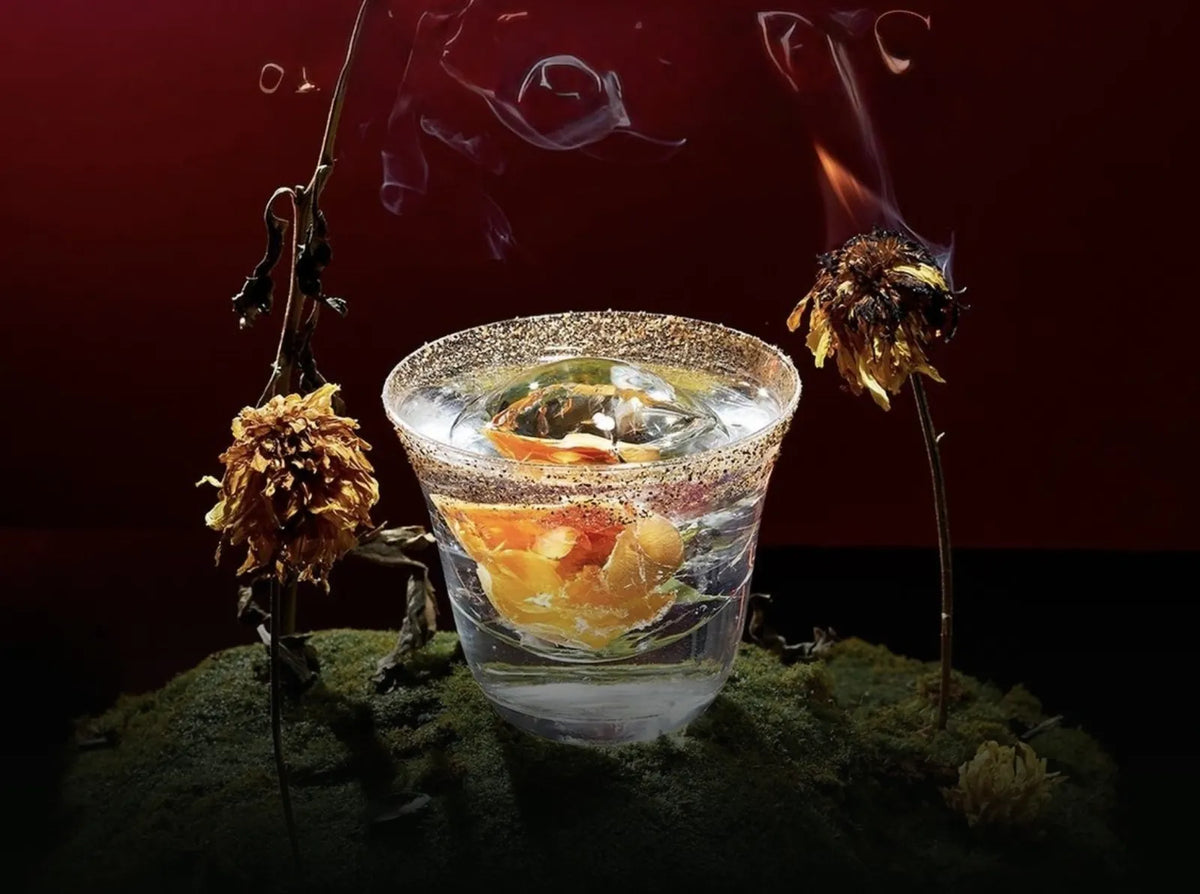 A zero-proof cocktail served on moss
